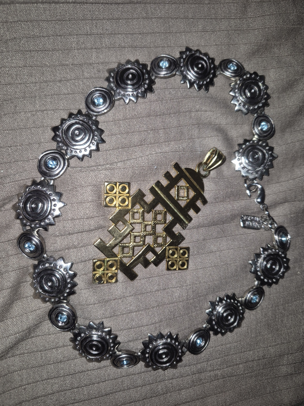 Source Unknown Silver Sunburst Necklace with Blue Stones and Gold Pendant